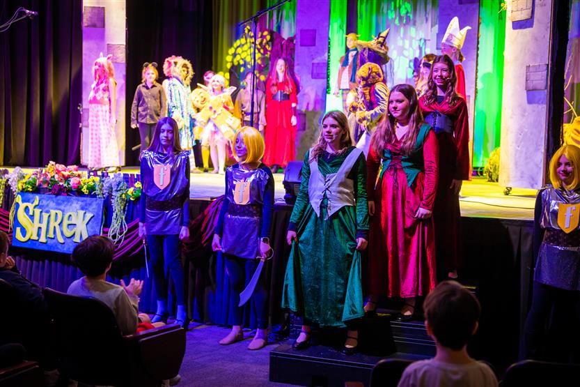 Students perform onstage